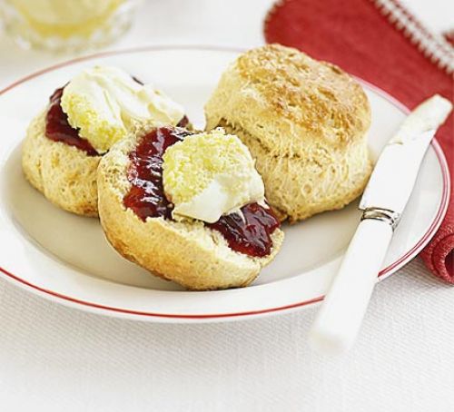 Scones with jam & clotted cream on a plate